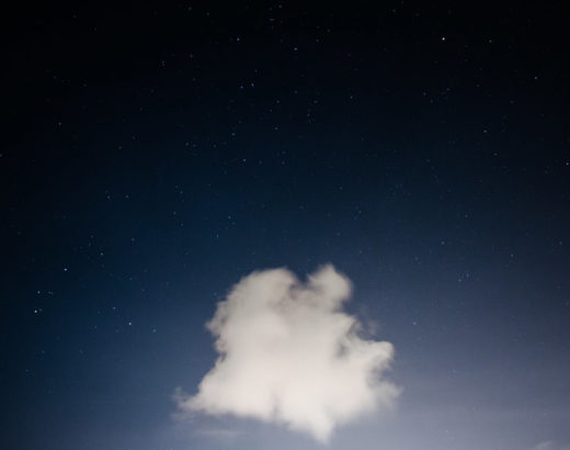Single cloud against a dark sky