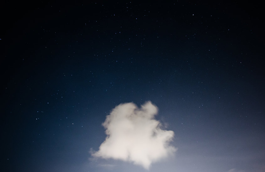 Single cloud against a dark sky