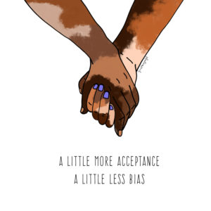hands with different skin colour patches holding each other