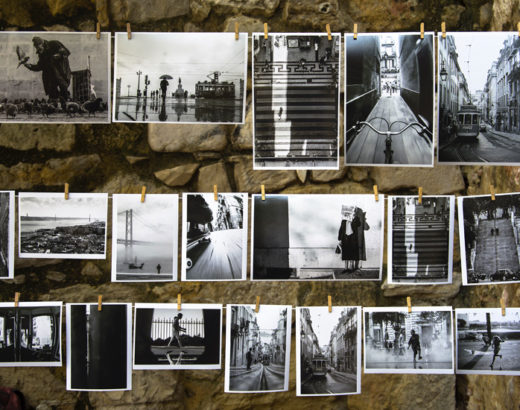 black and white pictures hung against a wal