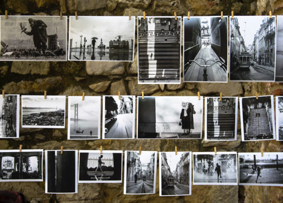 black and white pictures hung against a wal