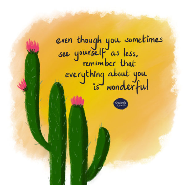 flowering cactus against an orange sky with writing