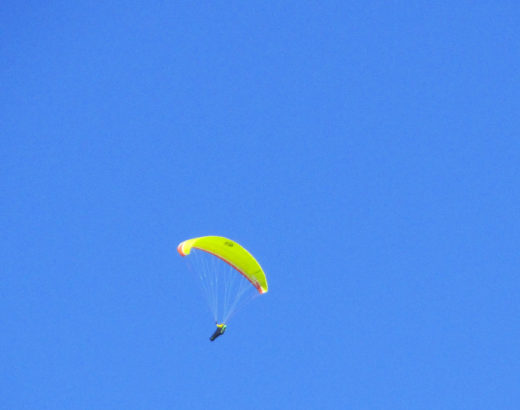 person gliding in blue sky